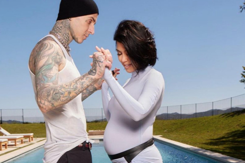 Kourtney Kardashian (r.) dished on the spicy way she moved along her delivery with the help of Travis Barker.