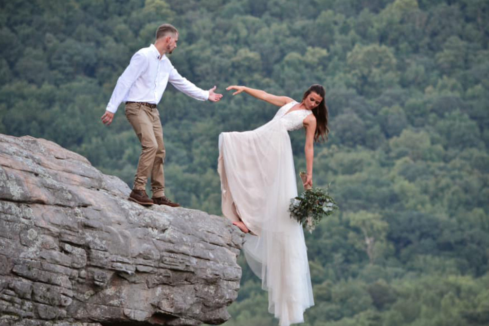 Is the bride about to fall off? Her bulging dress hides the secret to her safety.