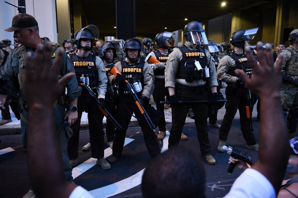 State troopers and members of the National Guard stand arrayed against Black Lives Matter protesters in Tulsa, Oklahoma.