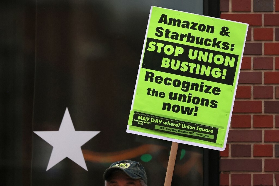 Protesters rally against Starbucks' union-busting tactics – including firing pro-union workers – outside a store in New York City.