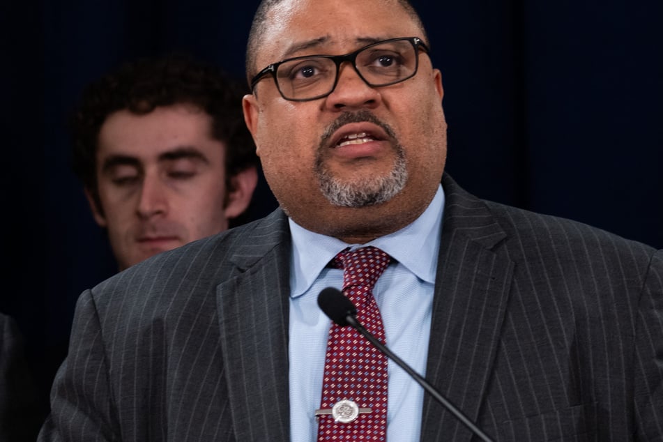 Manhattan District Attorney Alvin Bragg stands with members of his staff at a news conference following the conviction of former President Donald Trump in his hush money trial on May 30, 2024 in New York City.