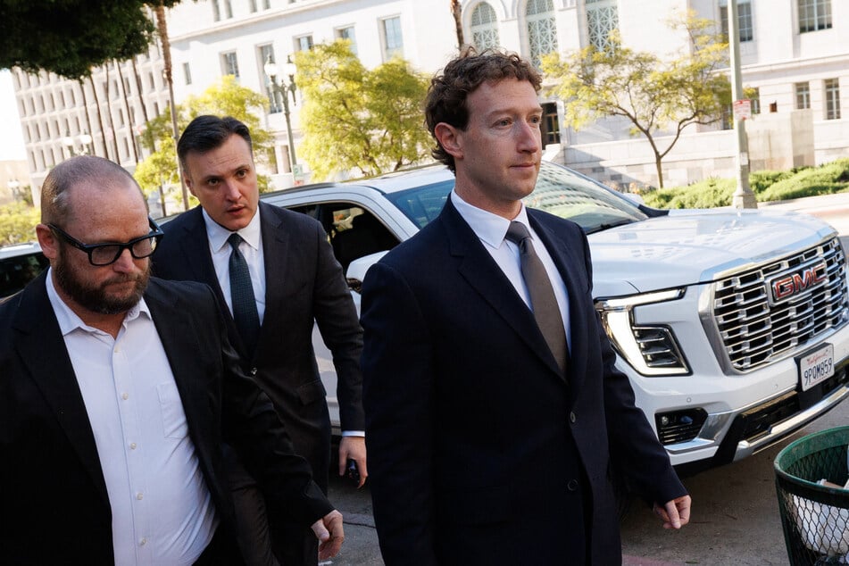 Meta CEO and Chairman Mark Zuckerberg (R) arrives at Los Angeles Superior Court ahead of the social media trial tasked to determine whether social media giants deliberately designed their platforms to be addictive to children, in Los Angeles, on February 18, 2026.