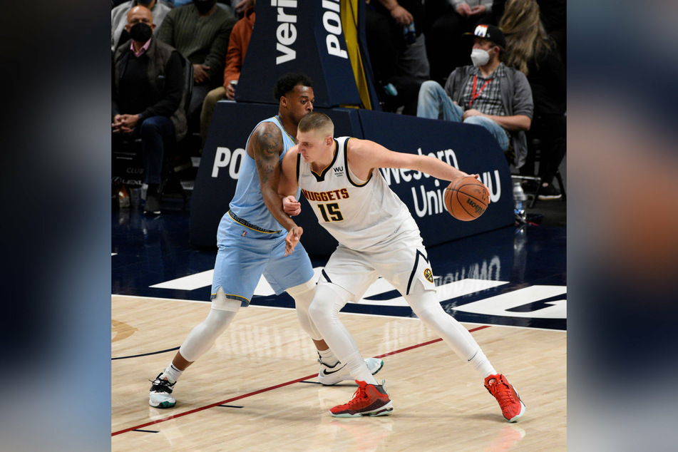 Denver Nuggets center Nikola Jokic drives towards the basket against Memphis Grizzlies forward Jaren Jackson.