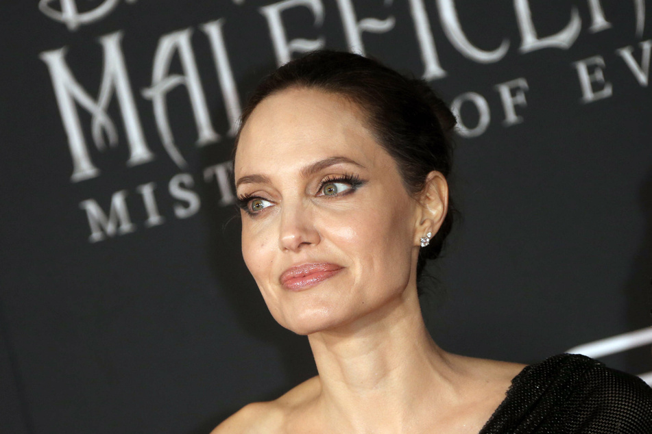 Angelina jolie is supposedly not a fan of her ex- husband's new relationship.