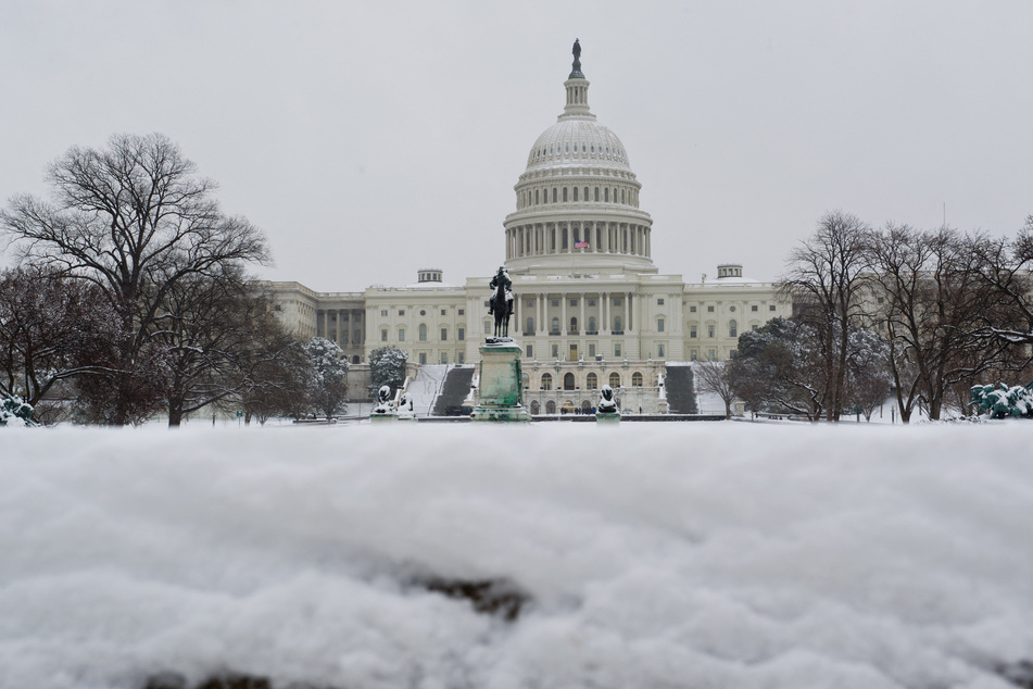 A snowy US Capitol is seen in Washington, DC March 17, 2014, the morning after 5-10 inches of snow fell in the Washington, DC area overnight.