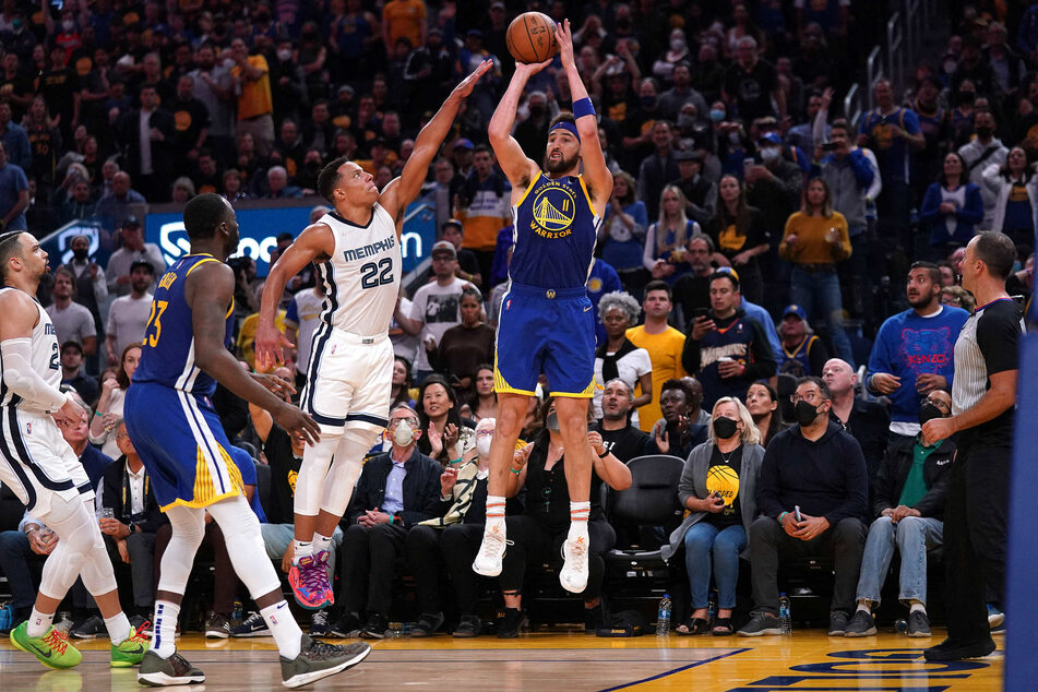 Golden State Warriors guard Klay Thompson (r.) jumped for the shot over the Memphis Grizzlies during game six of the second round for the 2022 NBA playoffs.
