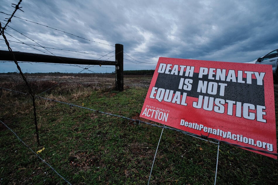 A protest sign against the death penalty stands outside of W.C. Coleman Correction Facility in Atmore, Alabama.