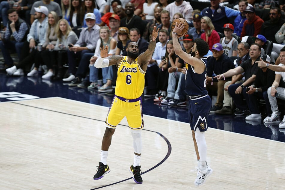 Jamal Murray shoots against Los Angeles Lakers forward LeBron James in the fourth quarter during Game 2 of the Western Conference Finals.