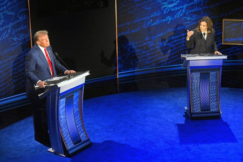 Donald Trump (l.) listening as Kamala Harris speaks during the 2024 presidential debate at the National Constitution Center in Philadelphia, Pennsylvania on September 10, 2024.