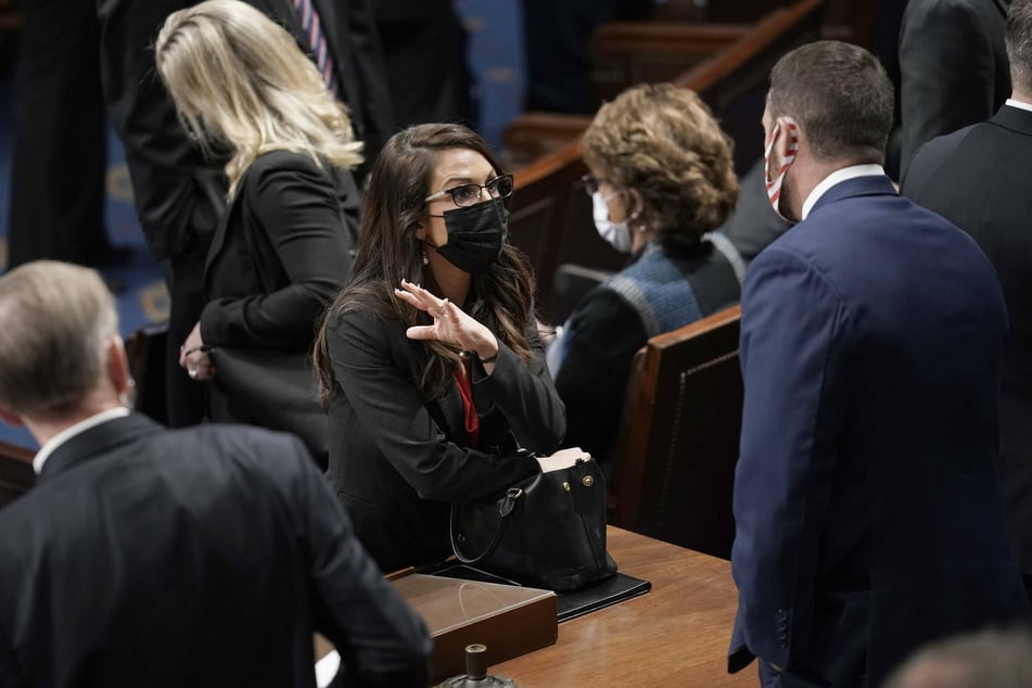 Freshman Congresswoman Lauren Boebert (c.) has caused quite a stir in her first days on the job.