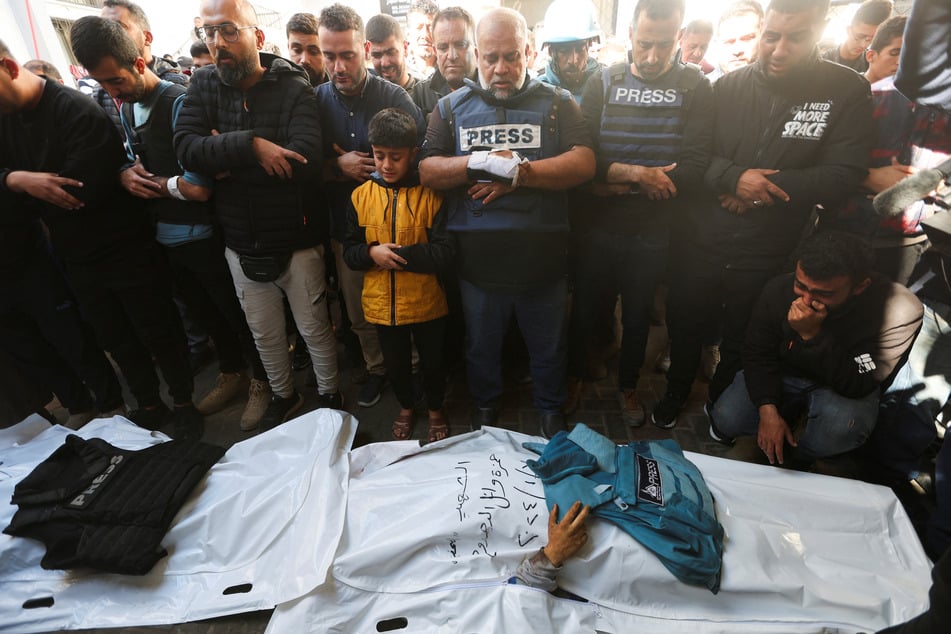 Journalist Hamza Wael Dahdouh, the son of Al Jazeera's Gaza bureau chief Wael al-Dahdouh (c.), was killed by an Israeli airstrike on Sunday.