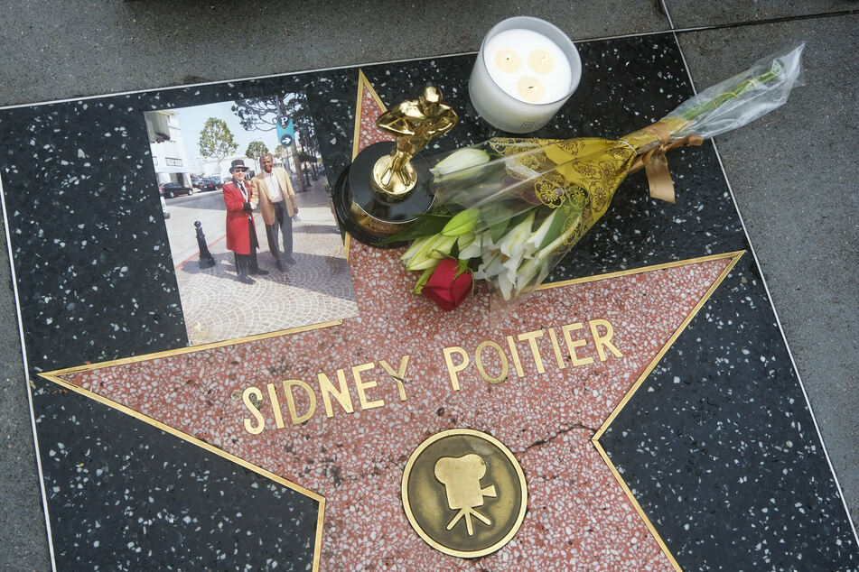 Flowers and candles were displayed at the Hollywood Walk of Fame star of the late actor Sidney Poitier on Friday.
