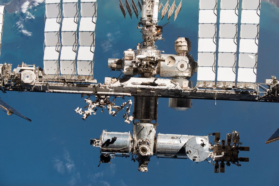 This handout image released by NASA on September 19, 2024 shows the International Space Station's US segment and portions of the Russian segment pictured from the SpaceX Crew Dragon Endeavour during a fly-around of the orbiting lab that took place following its undocking from the Harmony module’s space-facing port on Nov. 8, 2021.