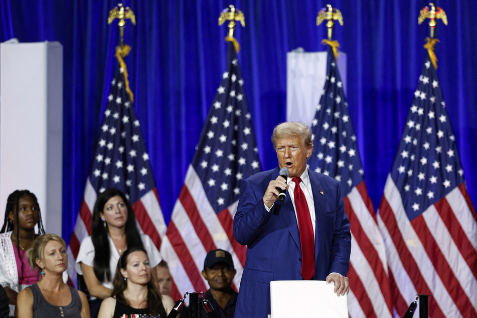 Former US President and Republican presidential candidate Donald Trump speaks during a town hall meeting at La Crosse Center in La Crosse, Wisconsin, on Thursday.