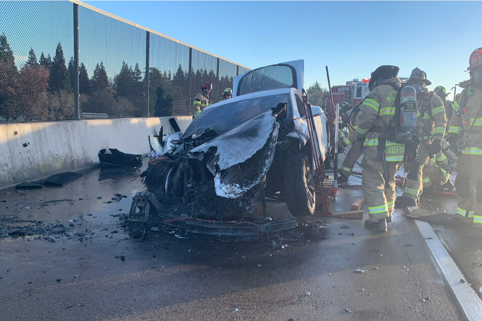 Saturday's accident showed a Tesla, which has caught fire, being extinguished by local firefighters using 6,000 gallons of water.