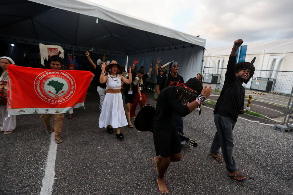 Young Indigenous people from various continents perform during the COP30 climate conference in Belem, Brazil, on November 21, 2025.