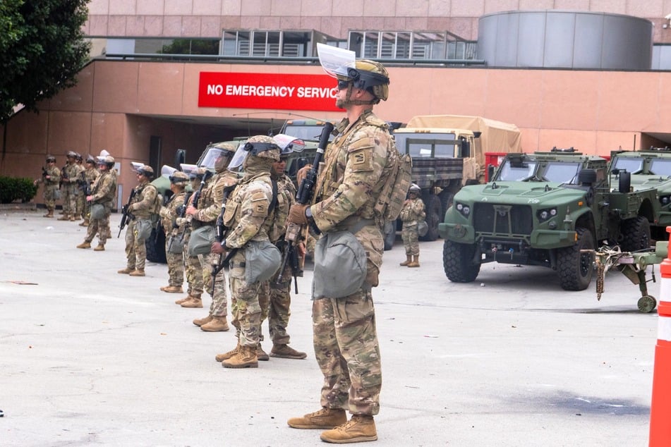 National Guard troops stand outside the Metropolitan Detention Center, MDC in Los Angeles, California on Sunday.