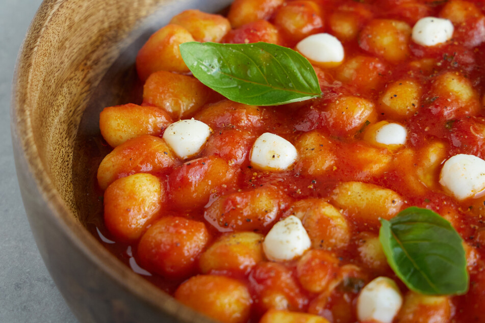 Keep homemade gnocchi simple. All you need is some tomato, mozzarella, garlic, and basil.