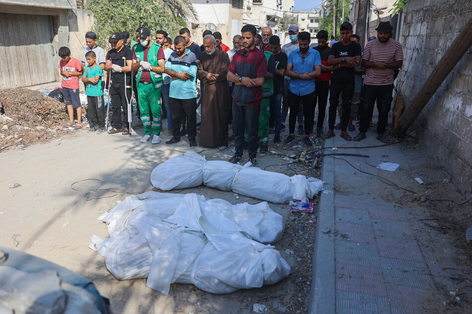 Gazans reported discovering "around 40 bodies" in areas of Gaza City vacated by Israeli troops on Friday.