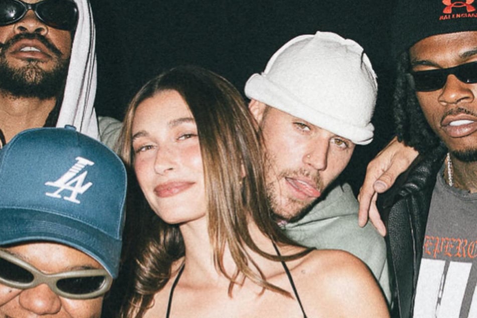 Justin Bieber posed with his wife, Hailey (center l.), at a listening party for his surprise album, Swag.