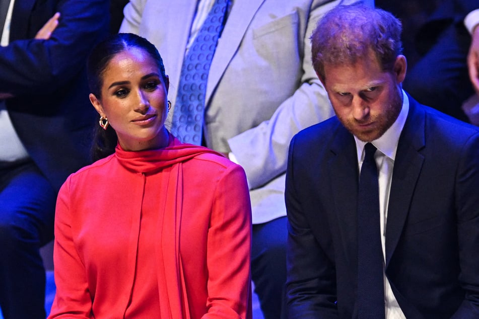 Meghan Markle (l.) and Prince Harry recently renewed their deal with Netflix, but insiders claim the agreement is not as lucrative as their last contract.