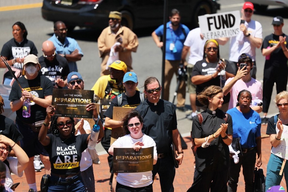 New Jersey residents march and rally for reparations at Newark City Hall.