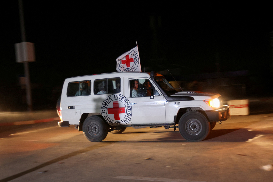 Hostages released by Hamas arrive at the Rafah border crossing between Gaza and Egypt amid a truce between Israel and the militant Islamic group.