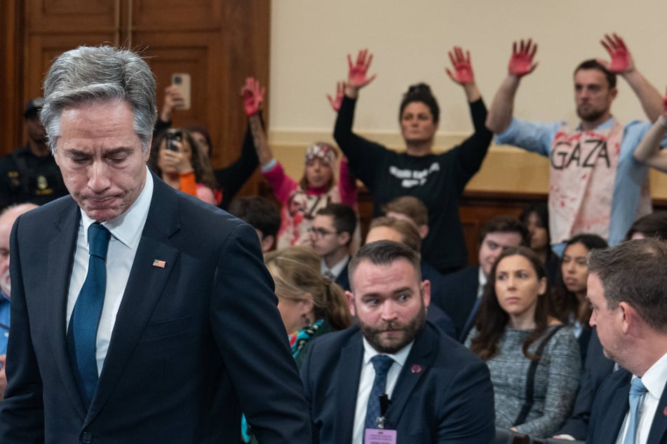 Pro-Palestinian activists disrupted Secretary of State Antony Blinken's (l.) testimony before Congress in condemnation of his support for Israel's genocide in Gaza.