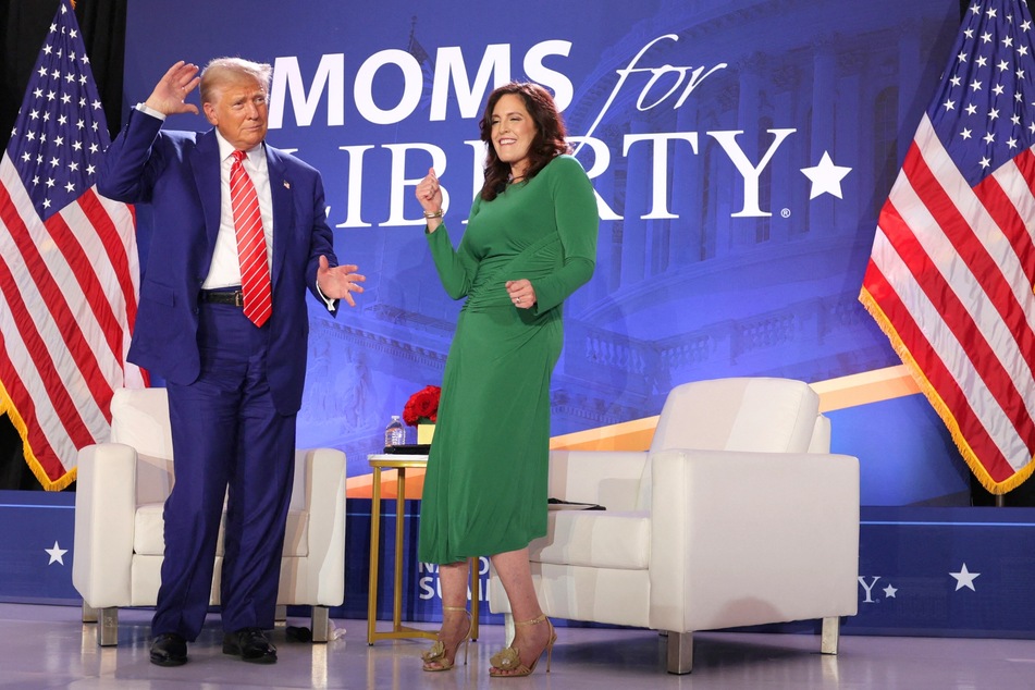 Donald Trump (l.) and Moms for Liberty co-founder Tiffany Justice dancing on stage during the group's annual summit in Washington DC on August 30, 2024.