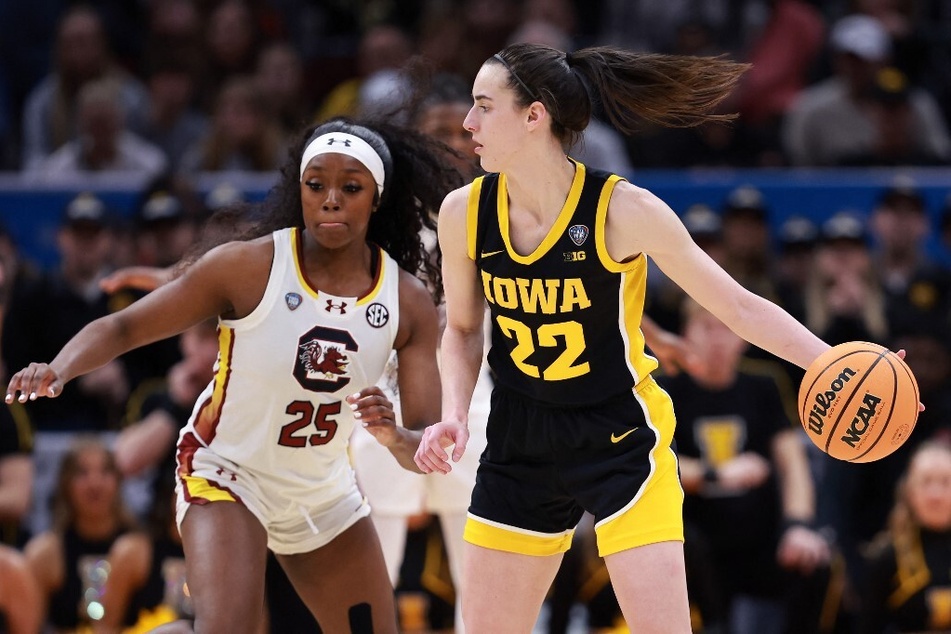 Caitlin Clark's (r.) college basketball games with the Iowa Hawkeyes broke several ratings records this season.