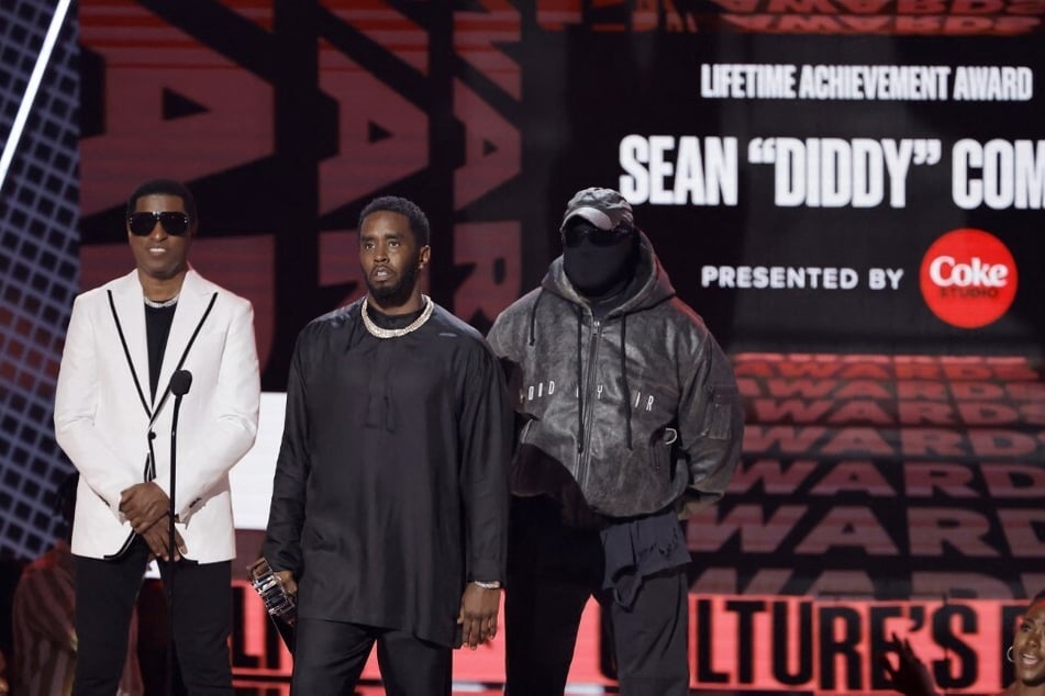 Ye and Kenneth "Babyface" Edmonds (l) appear to honor Diddy at the annual BET Awards on Sunday.