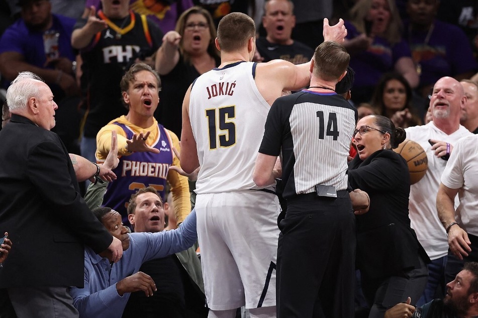 Phoenix Suns owner Mat Ishnia broke his silence over his altercation with Denver Nuggets player Nikola Jokić (c.), which caused an uproar in the NBA world.