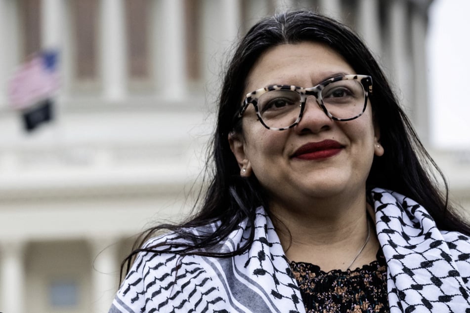 Representative Rashida Tlaib wears a Palestinian keffiyeh during a Gaza ceasefire demonstration on the US Capitol lawn.