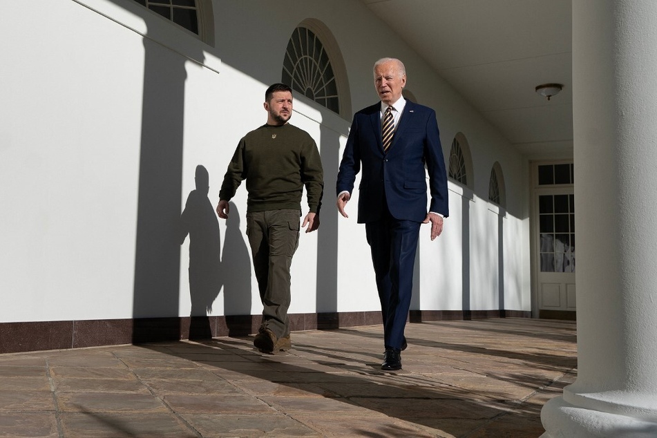 President Joe Biden walks with Ukraine's President Volodymyr Zelensky through the colonnade of the White House on December 21, 2022.