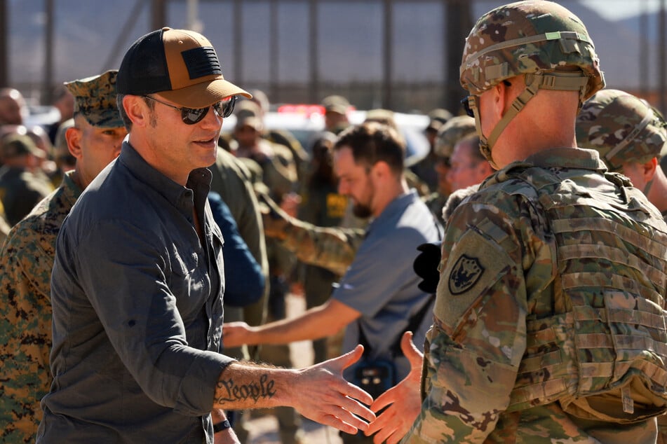 In his first trip as Pentagon chief, Pete Hegseth (l.) met with US troops and then traveled to the frontier itself.