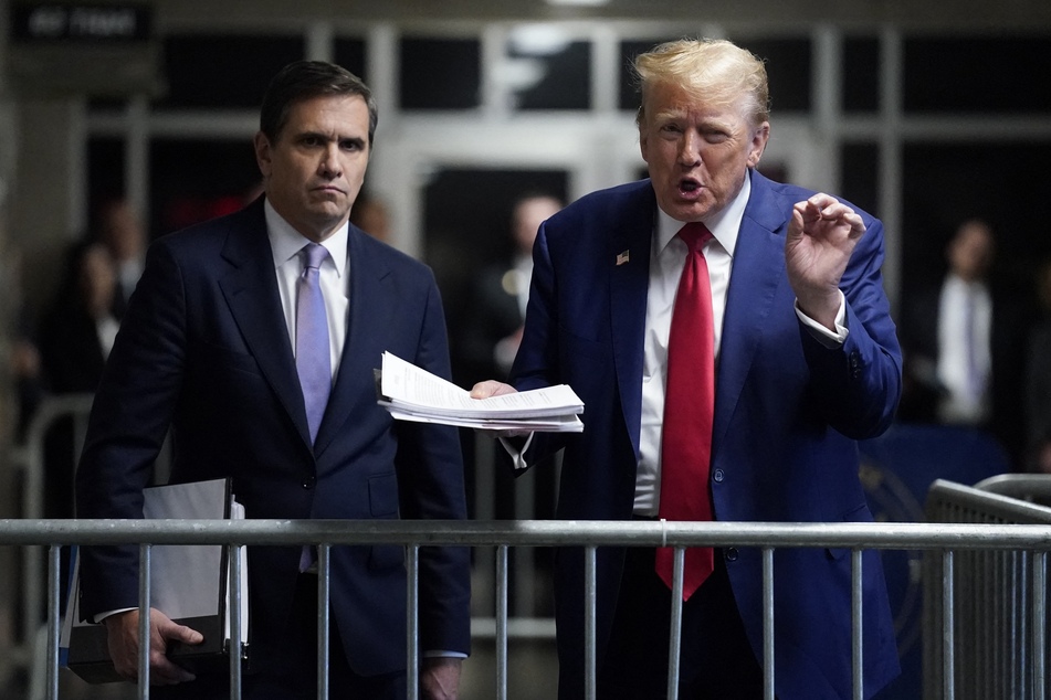 Former US President Donald Trump (r.), with attorney Todd Blanche (l.), speaks to the press before leaving for the day at his trial for allegedly covering up hush money payments linked to extramarital affairs at Manhattan Criminal Court in New York City on Friday.