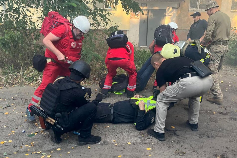 Ukraine's National Police condemned the twin strikes as a "cynical attack" that killed one policeman and injured another.