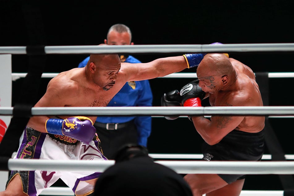 Roy Jones Jr. throws a punch in the second round against Mike Tyson during their exhibition bout.