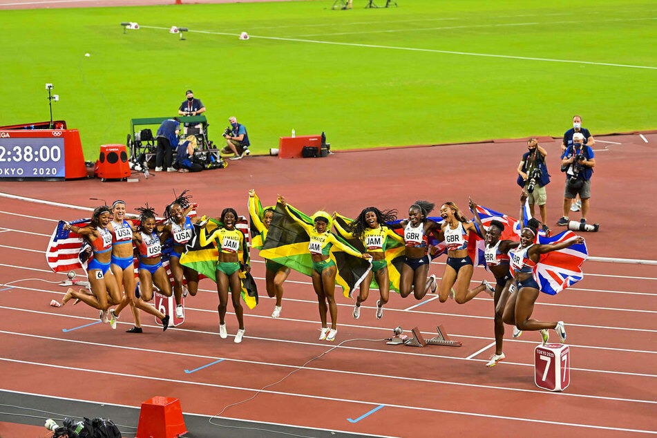 Team Jamaica (c.) finished first, Team USA (l.) second, and Team Great Britain (r.) third in the women's 4x100-meter final on Friday.