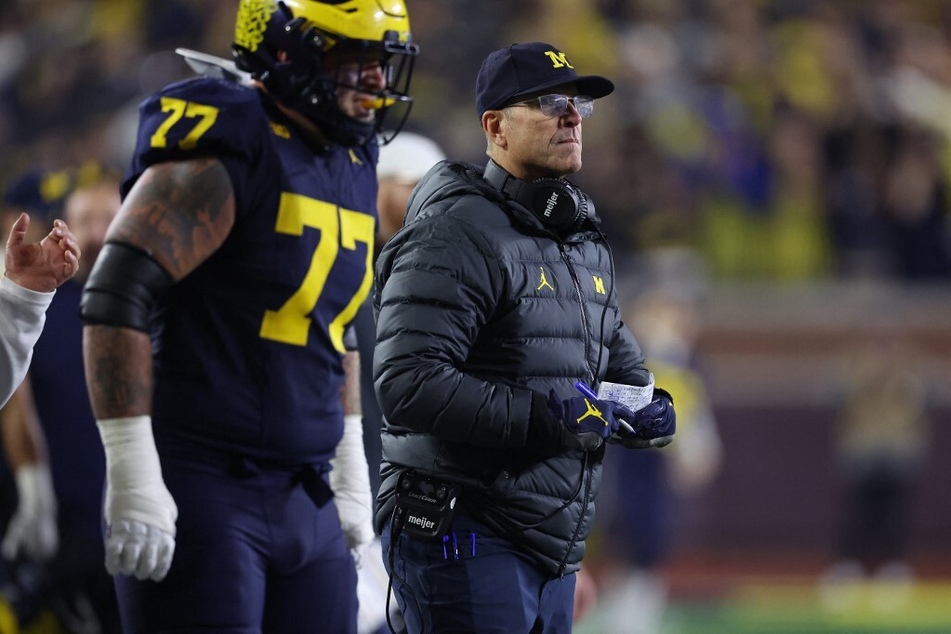 Michigan football continue to face scrutiny over a cheating scandal, and some fans are not pleased with the Wolverines playing in the championship game.