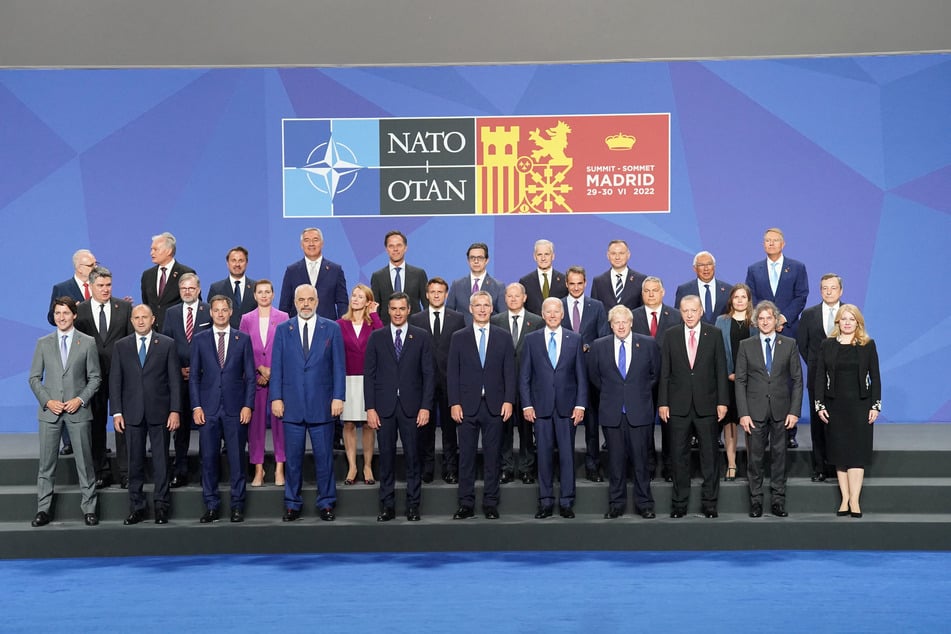 NATO leaders pose for a group photo on a hugely significant day for global security.