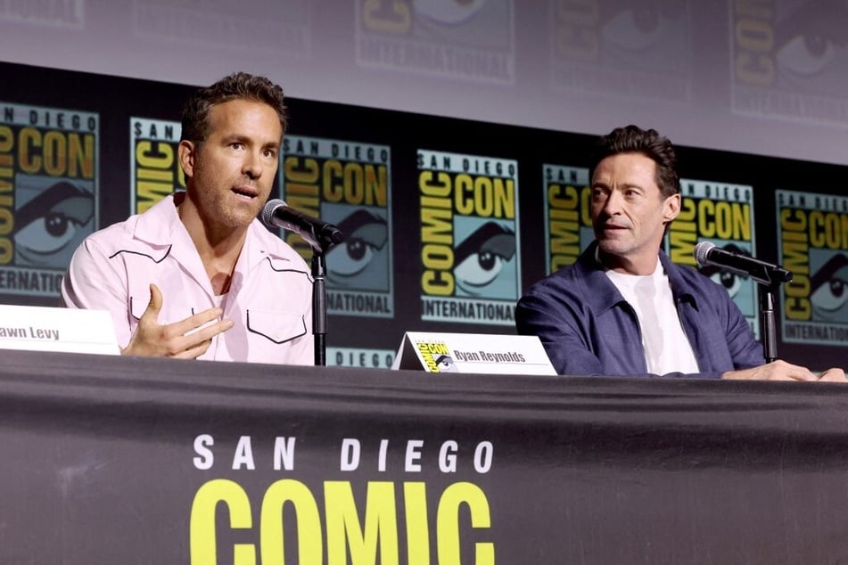 Ryan Reynolds (l.) and Hugh Jackman speak onstage during Marvel Studios: The Ultimate Deadpool &amp; Wolverine Celebration of Life at Comic-Con in San Diego, California.