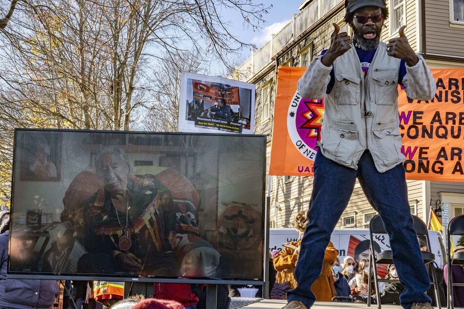 Leonard Peltier is pictured on a screen as he speaks via video message during the 2025 National Day of Mourning.