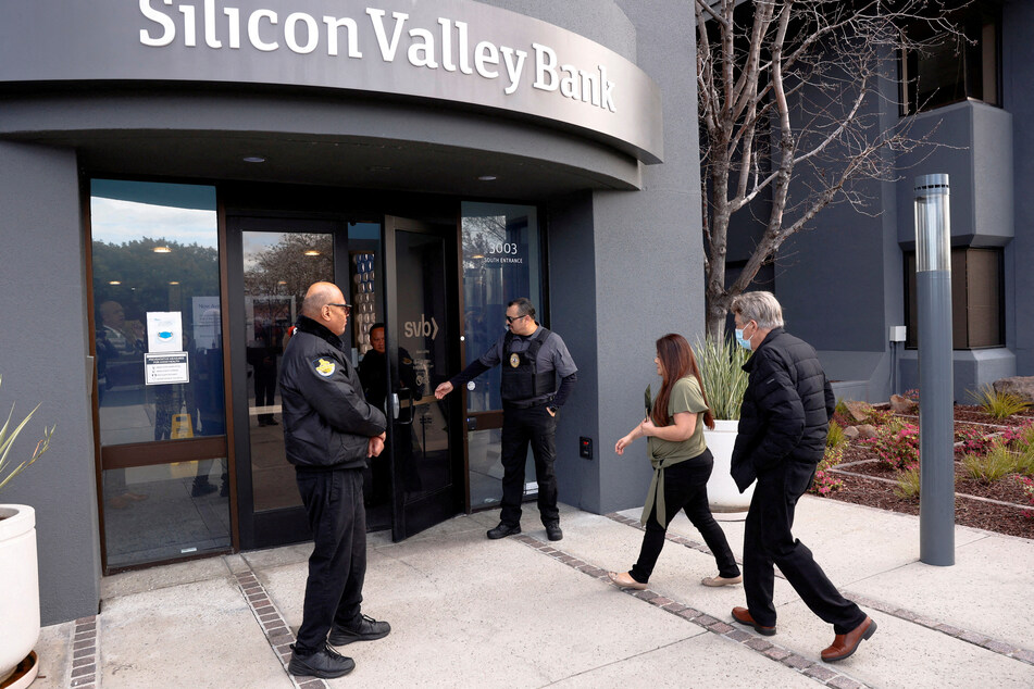 A customer is escorted into the Silicon Valley Bank headquarters in Santa Clara, California.