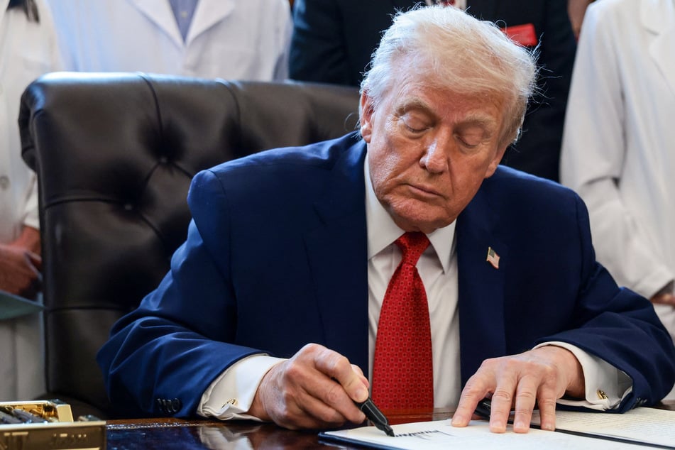 Trump quietly signs massive military spending bill that bucks hostile position on Europe