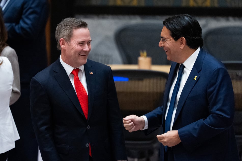 US Ambassador to the UN Mike Waltz (l.) talks with Israel Ambassador to the UN Danny Danon as members of the UN Security Council meet to vote on a draft resolution to authorize an International Stabilization Force in Gaza, on November 17, 2025.