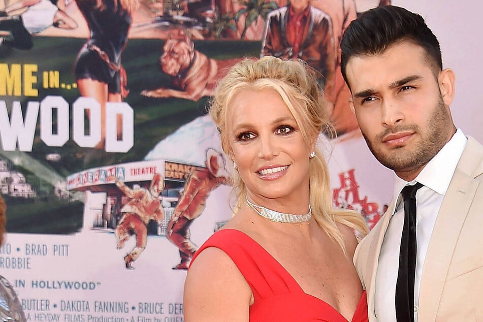 Sam Asghari (r.) compared his ex-wife, Britney Spears, to "oppressed" Iranian women after her DUI arrest on March 4.
