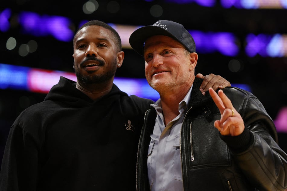 Actors Michael B. Jordan (l.) and Woody Harrelson during Game 6 of the Western Conference Semifinal Playoffs in Los Angeles.