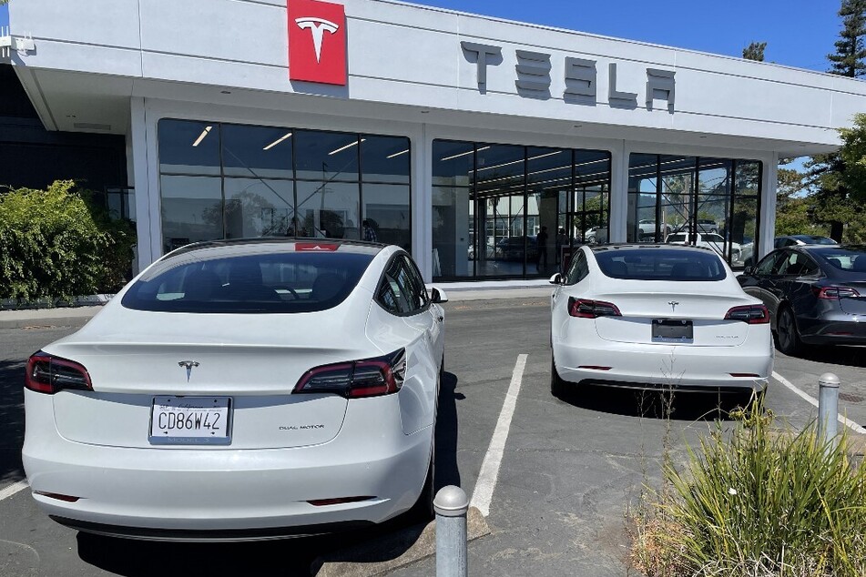 Brand new Tesla cars sit in a parking lot at a Tesla showroom in Corte Madera, California.