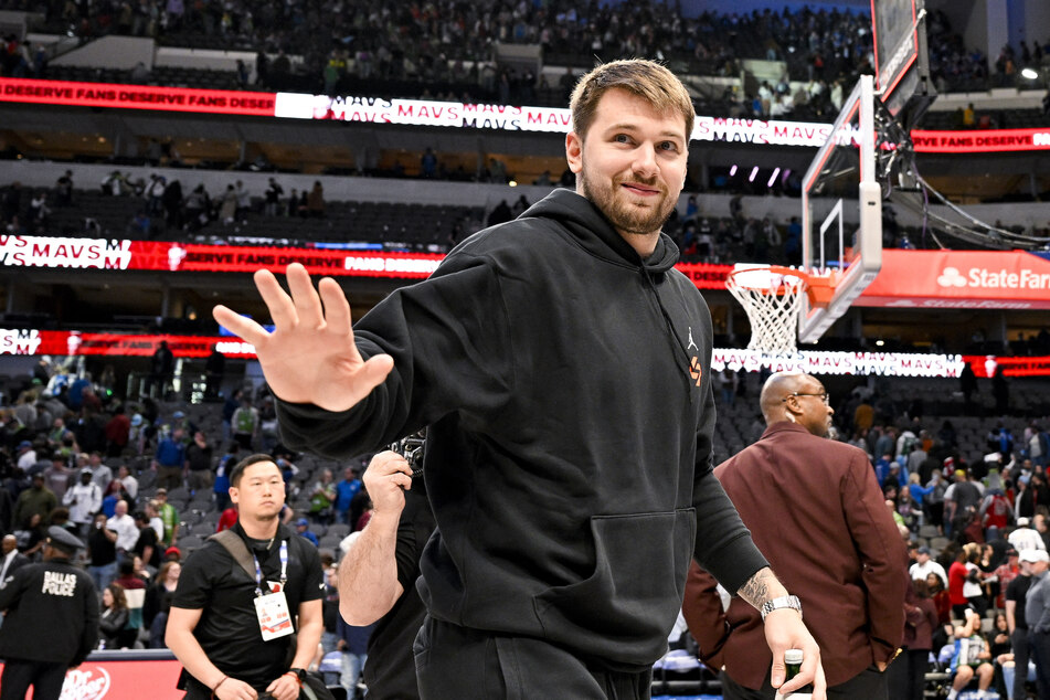 Dallas Mavericks guard Luka Doncic waves to the crowd as he walks off the court after the Mavericks loss to the Chicago Bulls at the American Airlines Center.